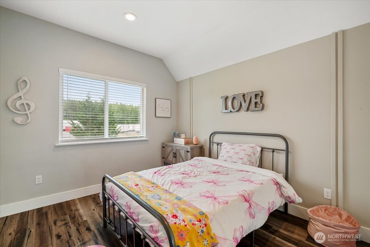 26709 Entwhistle Road East Buckley, WA 98321 - Photo 29 of 40 a bedroom with a bed and a window
