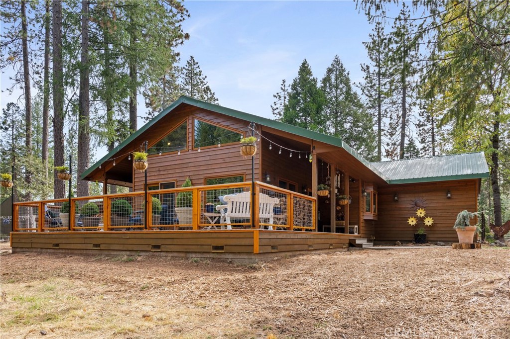 7501 Maddrill Lane Butte Meadows, CA 95942 - Photo 1 of 70 a front view of a house with a yard