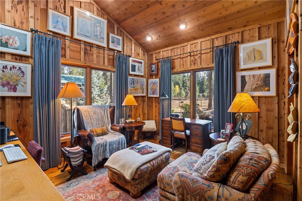 7501 Maddrill Lane Butte Meadows, CA 95942 - Photo 24 of 70 a living room with furniture a lamp and large window