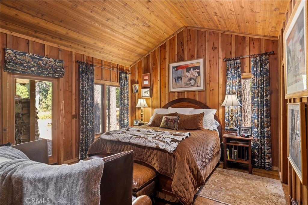 7501 Maddrill Lane Butte Meadows, CA 95942 - Photo 27 of 70 a bedroom with a bed and a mirror