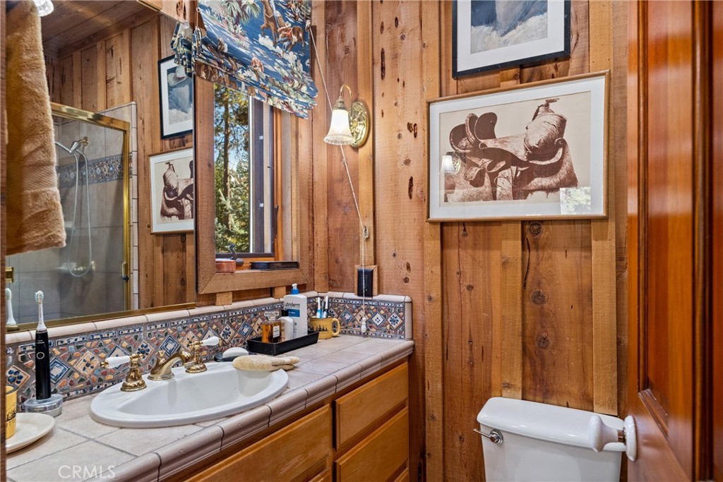 7501 Maddrill Lane Butte Meadows, CA 95942 - Photo 30 of 70 a bathroom with a sink and a mirror