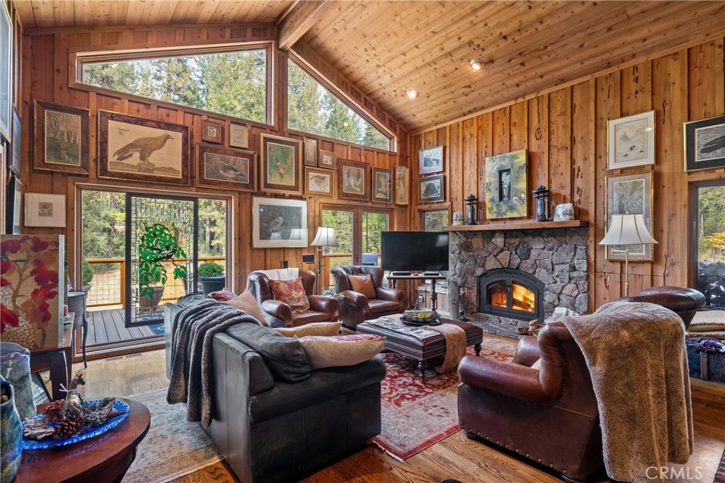 7501 Maddrill Lane Butte Meadows, CA 95942 - Photo 3 of 70 a living room with furniture a fireplace and a large window