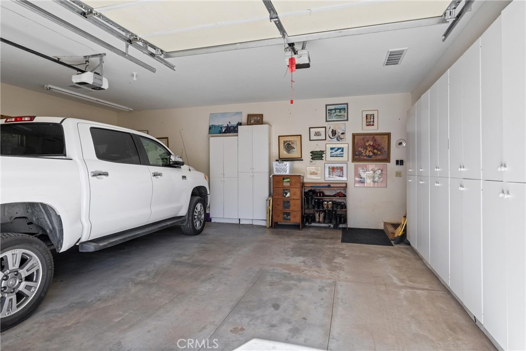 7501 Maddrill Lane Butte Meadows, CA 95942 - Photo 32 of 70 a view of a storage & utility room with lots of stuff