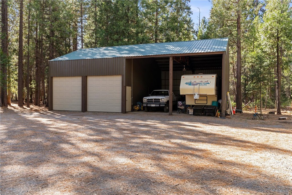 7501 Maddrill Lane Butte Meadows, CA 95942 - Photo 33 of 70 a view of a car in the back of a building
