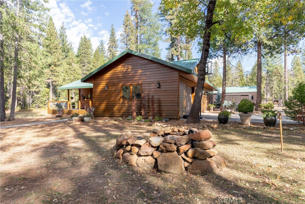 7501 Maddrill Lane Butte Meadows, CA 95942 - Photo 37 of 70 a backyard of a house with table and chairs