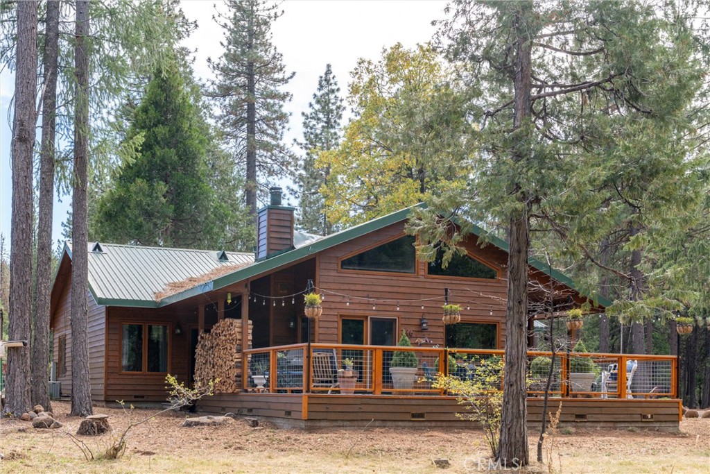 7501 Maddrill Lane Butte Meadows, CA 95942 - Photo 44 of 70 a front view of a house with garden