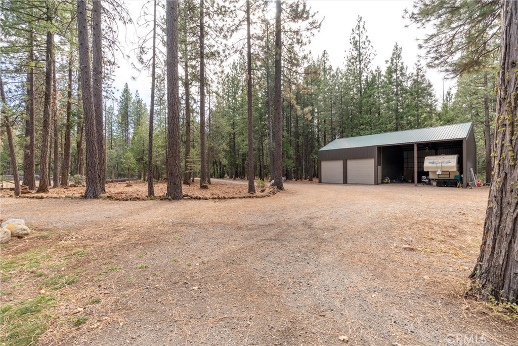 7501 Maddrill Lane Butte Meadows, CA 95942 - Photo 46 of 70 a view of house with trees in the background