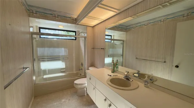 a kitchen with stainless steel appliances granite countertop a refrigerator and a stove