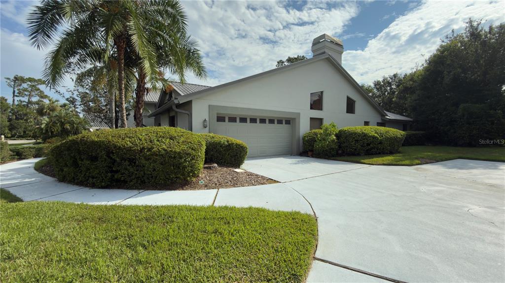 5040 Pinelake Road Wesley Chapel, FL 33543 - Photo 4 of 38 a house view with a outdoor space