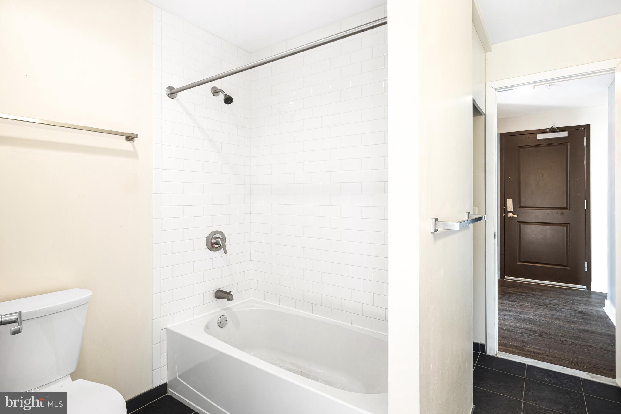523 North Broad Street, Unit P1 Philadelphia, PA 19123 - Photo 11 of 37 a bathroom with a bathtub and a shower