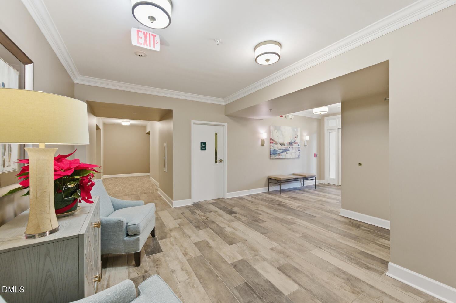 116 Northbrook Drive, Unit 204 Raleigh, NC 27609 - Photo 51 of 94 a bedroom with a bed and a chandelier