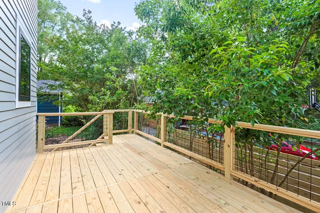 a view of balcony with deck and wooden floor