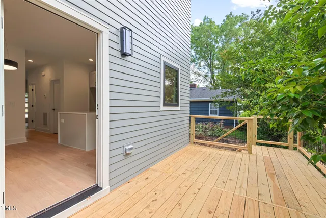 a view of a chair and tables in the balcony
