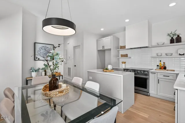 a kitchen with a table and chairs in it