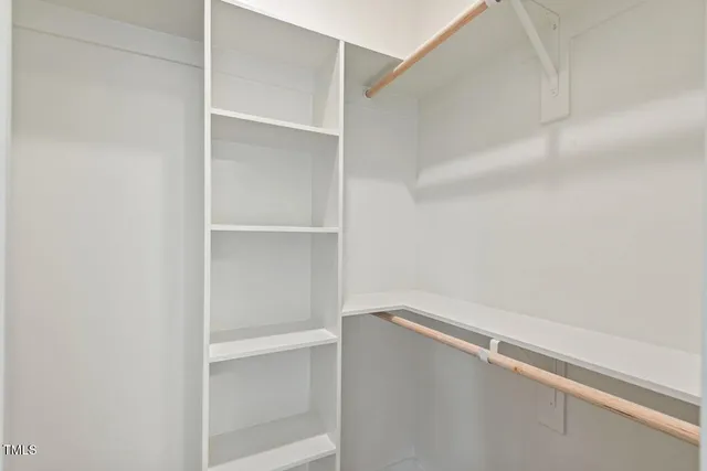 a view of an empty walk in closet