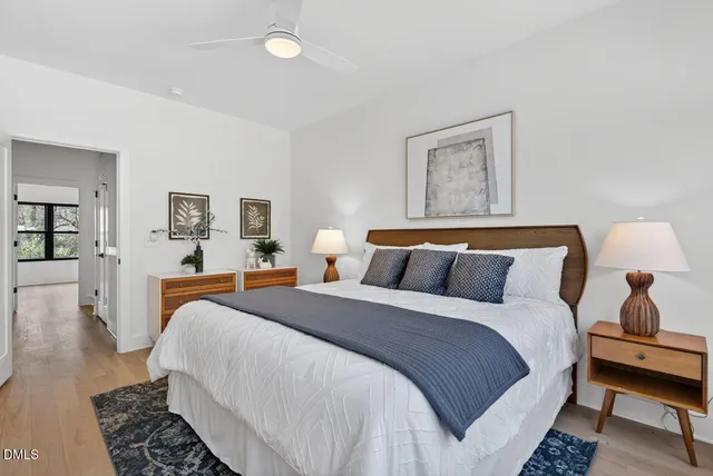 a bedroom with bed and window