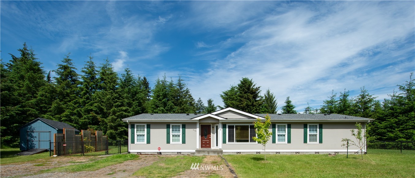 9134 176th Avenue Southwest Rochester, WA 98579 - Photo 1 of 24 a front view of a house with a garden