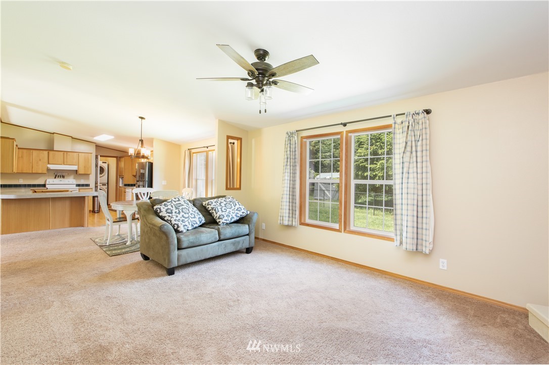 9134 176th Avenue Southwest Rochester, WA 98579 - Photo 14 of 24 a living room with furniture and a large window