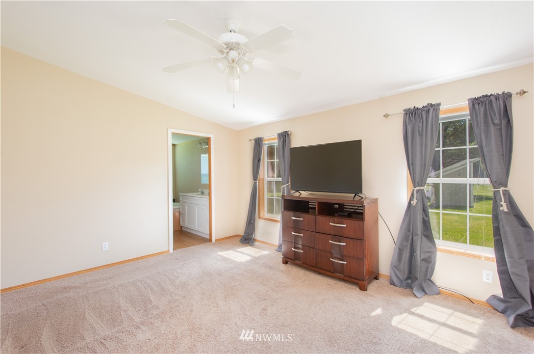 9134 176th Avenue Southwest Rochester, WA 98579 - Photo 16 of 24 a room with furniture and flat screen tv