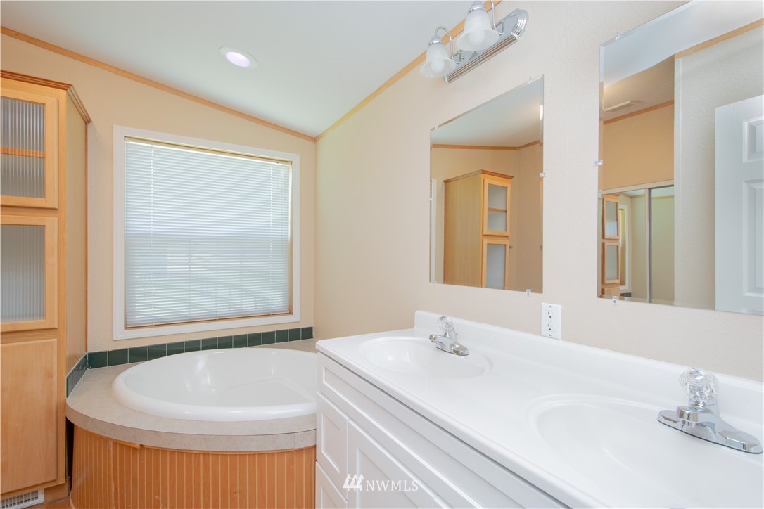 9134 176th Avenue Southwest Rochester, WA 98579 - Photo 18 of 24 a bathroom with a sink and a mirror