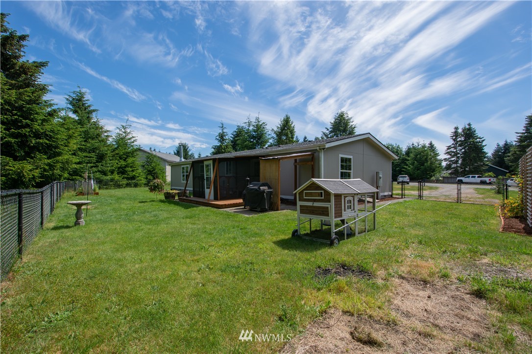 9134 176th Avenue Southwest Rochester, WA 98579 - Photo 3 of 24 a swimming pool with outdoor seating and garden