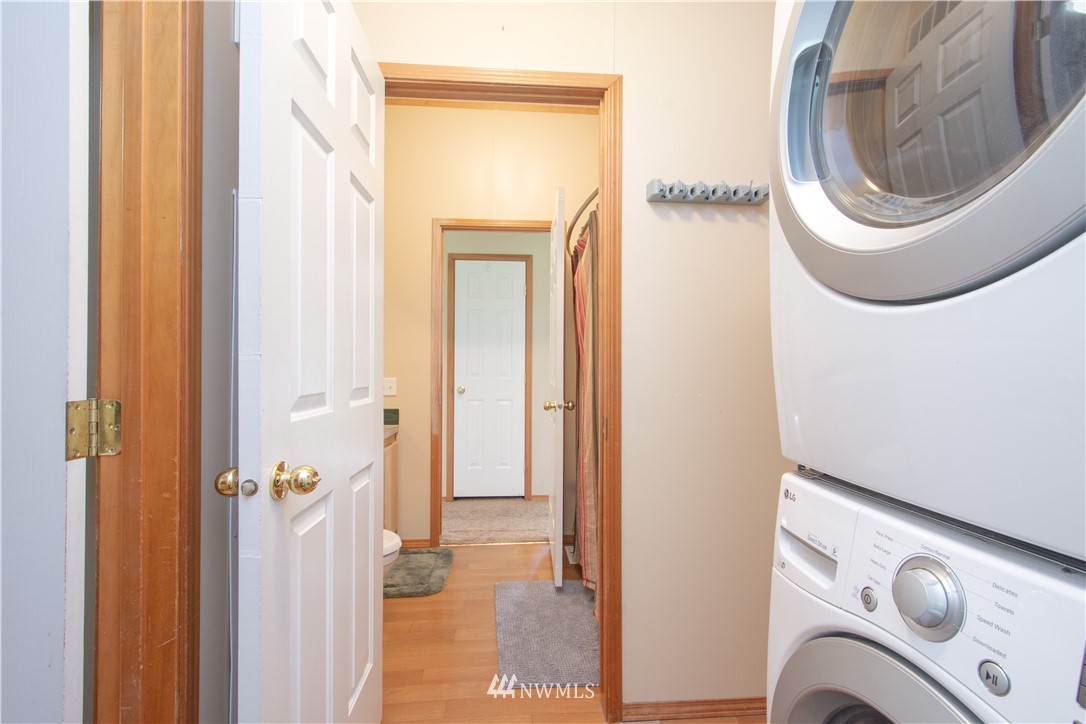 9134 176th Avenue Southwest Rochester, WA 98579 - Photo 24 of 24 a view of a hallway with washer and dryer