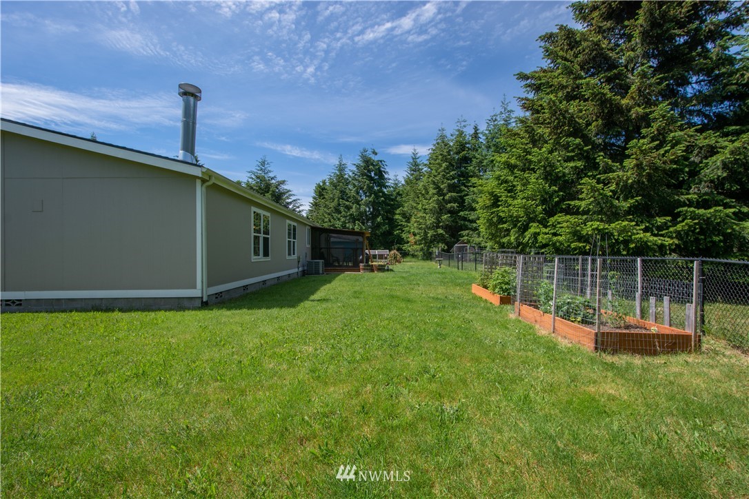 9134 176th Avenue Southwest Rochester, WA 98579 - Photo 4 of 24 a backyard of a house with lots of green space