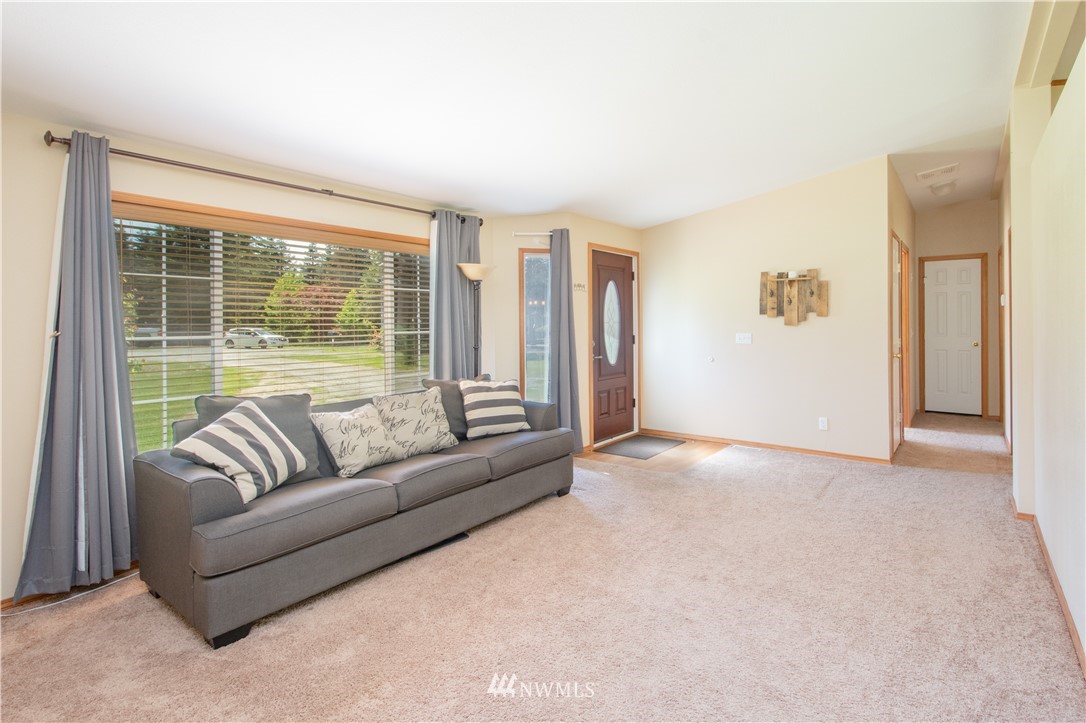 9134 176th Avenue Southwest Rochester, WA 98579 - Photo 8 of 24 a living room with furniture and a large window