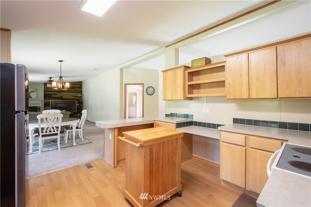 9134 176th Avenue Southwest Rochester, WA 98579 - Photo 10 of 24 a kitchen with a sink stove and cabinets