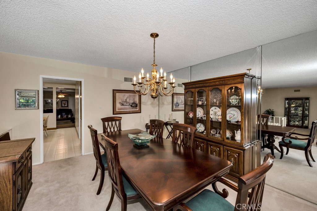 9916 Bothwell Road Northridge, CA 91324 - Photo 11 of 41 a dining room with furniture and chandelier