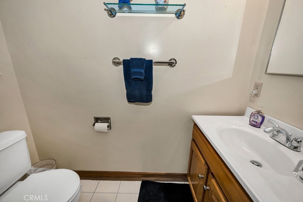 9916 Bothwell Road Northridge, CA 91324 - Photo 19 of 41 a bathroom with a sink toilet and vanity