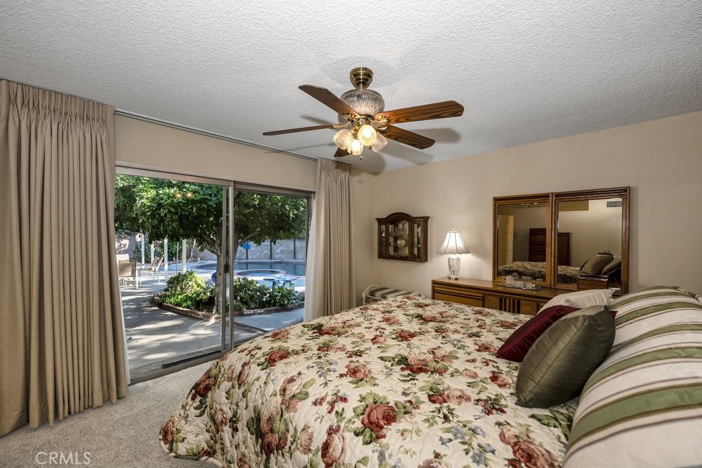9916 Bothwell Road Northridge, CA 91324 - Photo 21 of 41 a bed sitting in a bedroom next to a window