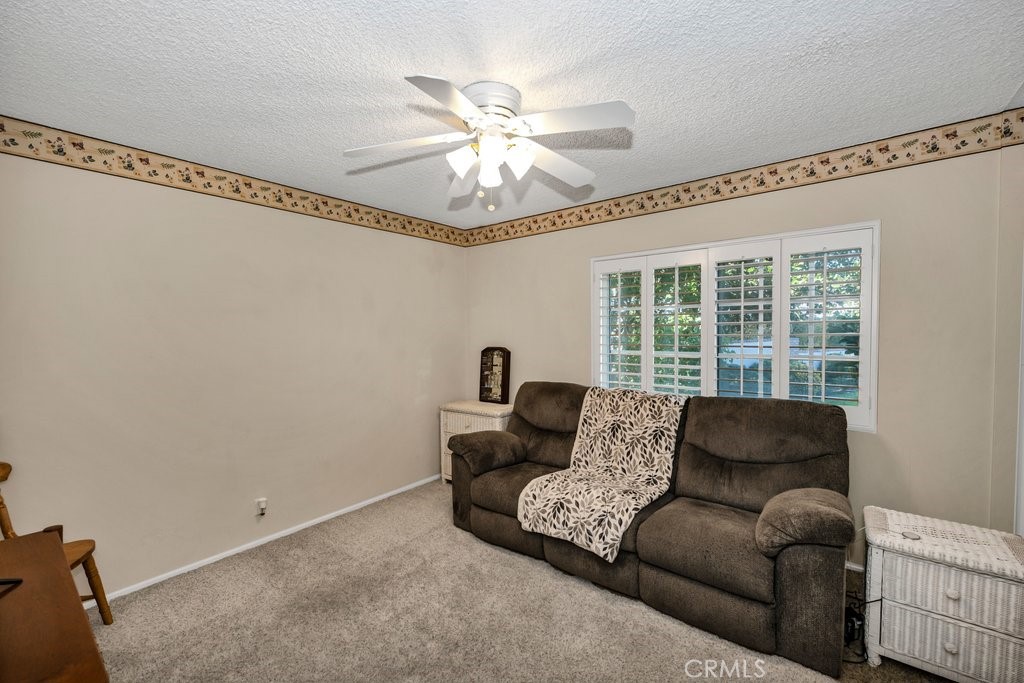 9916 Bothwell Road Northridge, CA 91324 - Photo 26 of 41 a living room with furniture and a large window