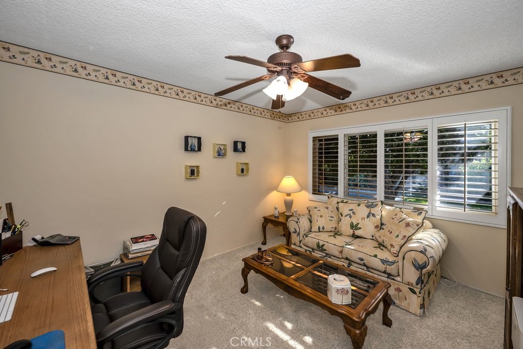 9916 Bothwell Road Northridge, CA 91324 - Photo 31 of 41 a living room with furniture a window and a chandelier