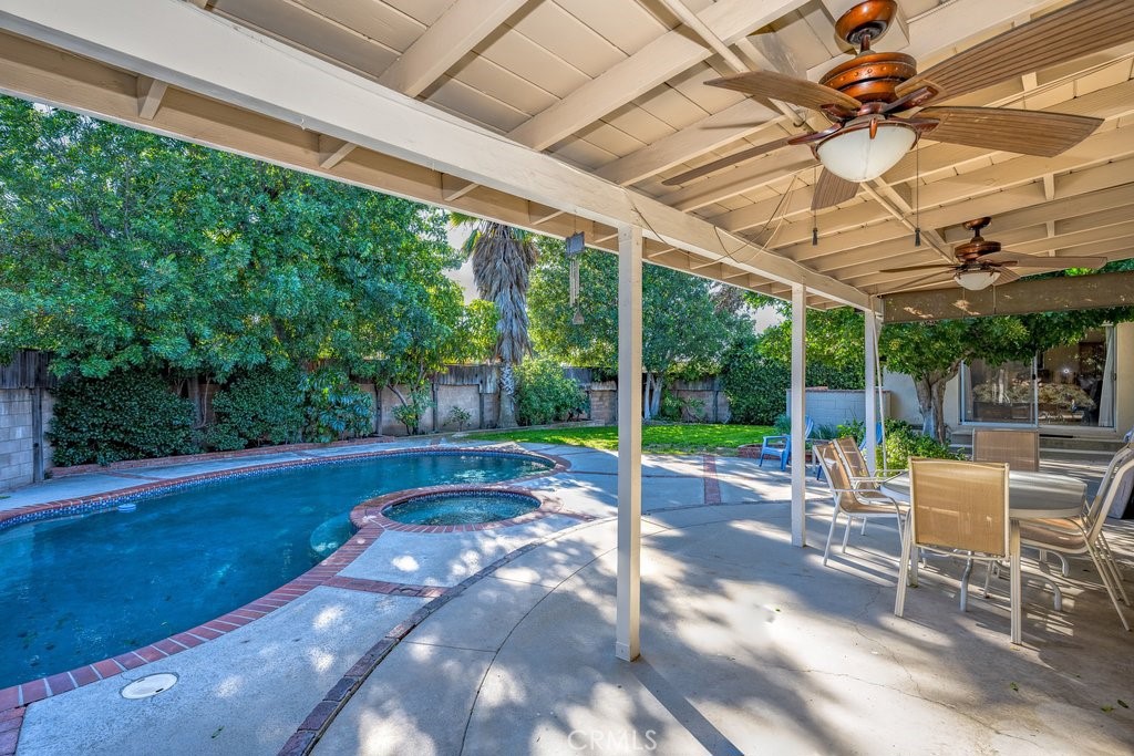 9916 Bothwell Road Northridge, CA 91324 - Photo 33 of 41 a view of a patio with a table chairs and a backyard