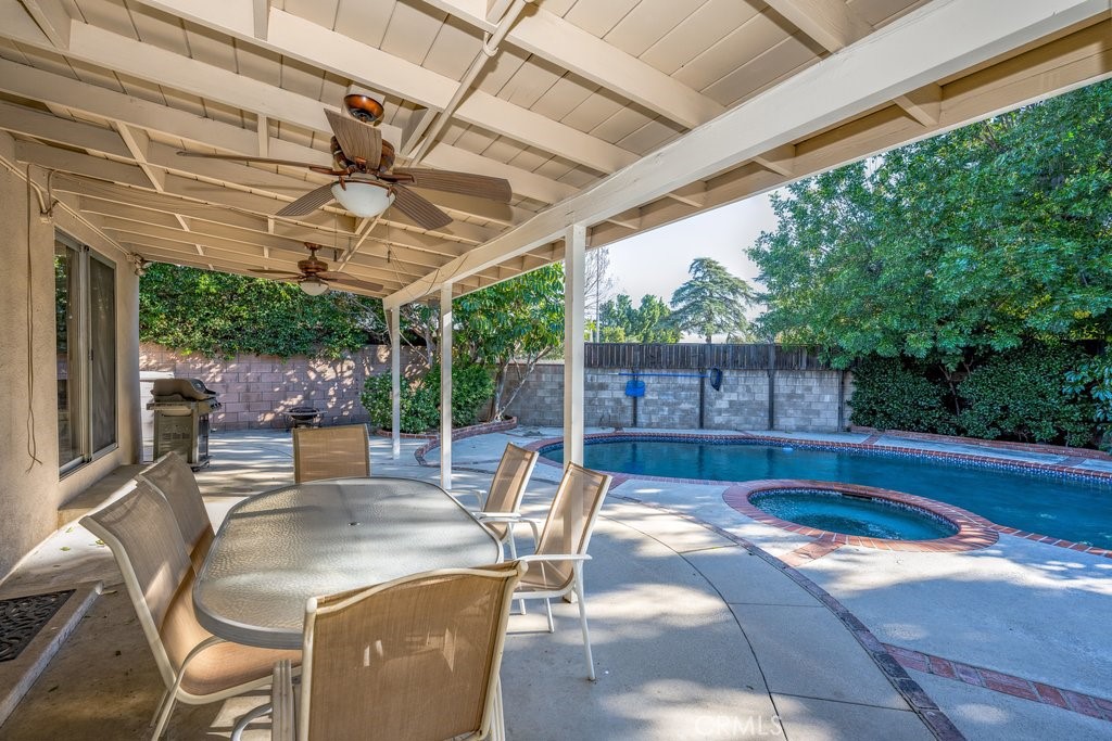 9916 Bothwell Road Northridge, CA 91324 - Photo 34 of 41 a view of a patio with a table chairs and a backyard