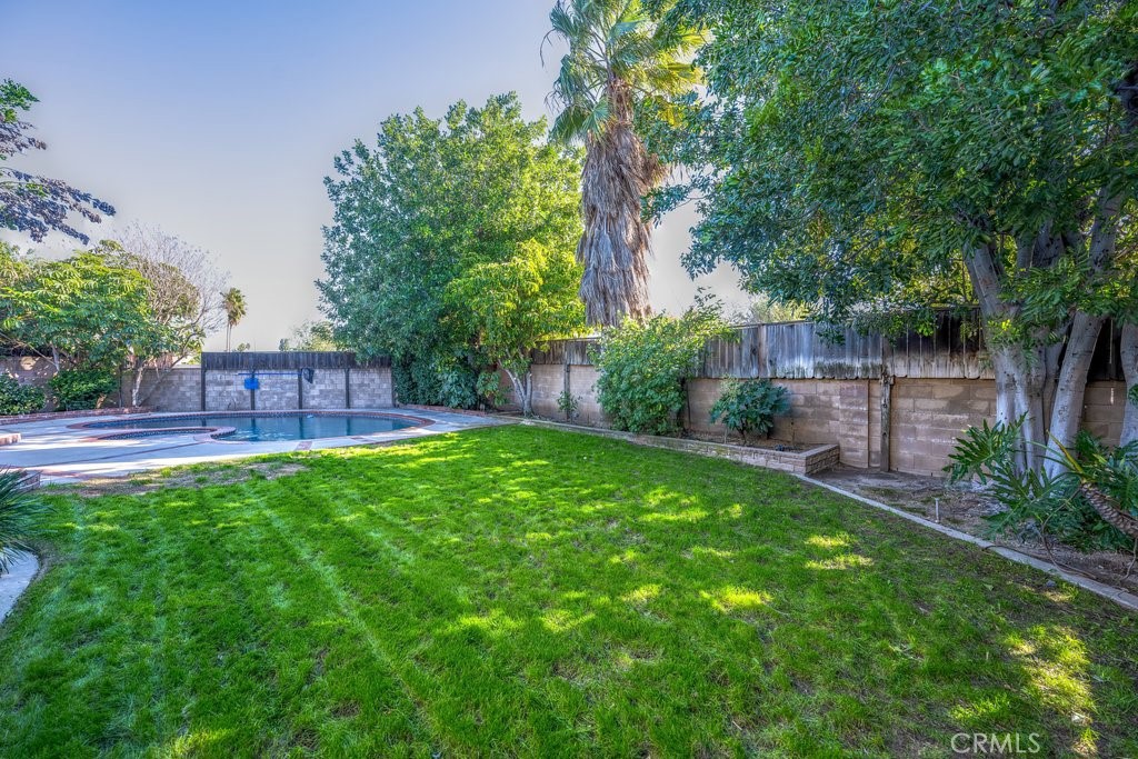 9916 Bothwell Road Northridge, CA 91324 - Photo 35 of 41 a view of yard with swimming pool and green space
