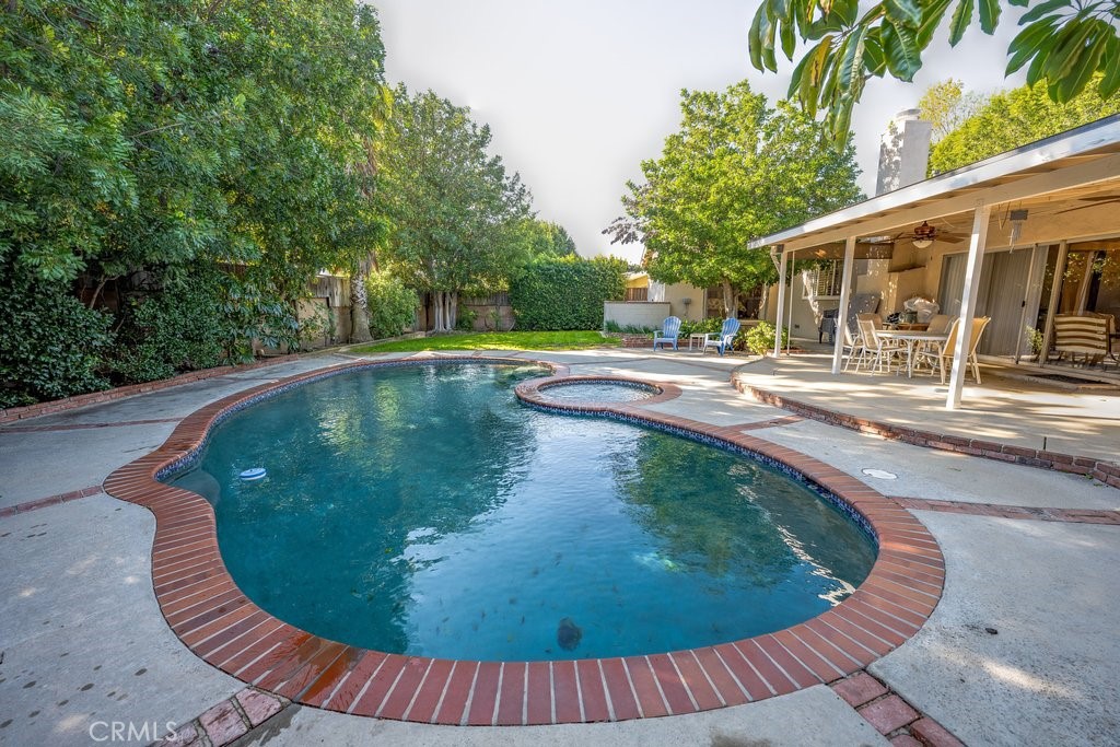 9916 Bothwell Road Northridge, CA 91324 - Photo 37 of 41 a view of a swimming pool with a patio