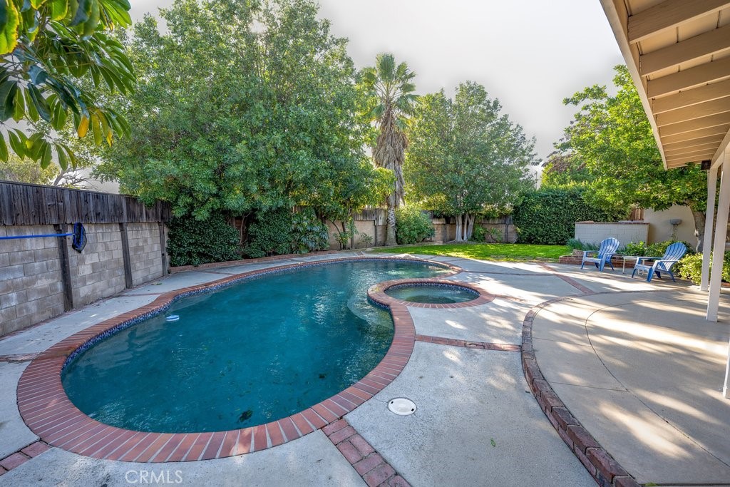 9916 Bothwell Road Northridge, CA 91324 - Photo 38 of 41 a view of a swimming pool with a patio