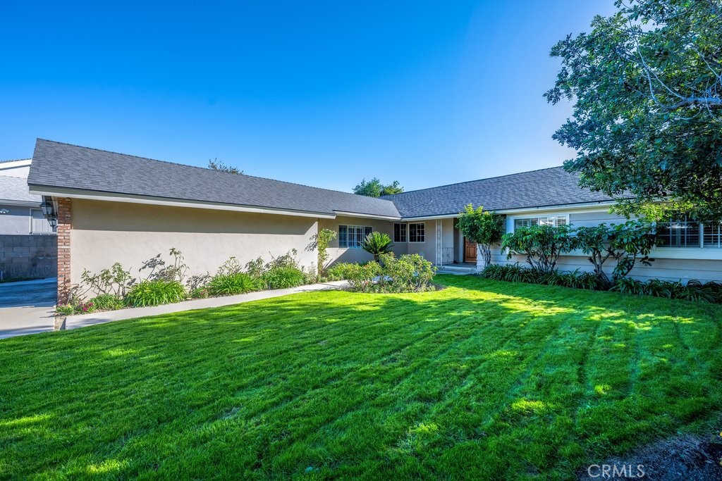 9916 Bothwell Road Northridge, CA 91324 - Photo 6 of 41 a front view of a house with garden