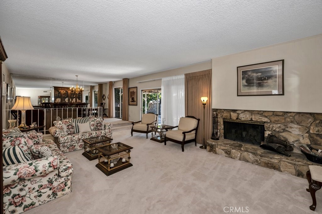 9916 Bothwell Road Northridge, CA 91324 - Photo 9 of 41 a living room with furniture and a fireplace