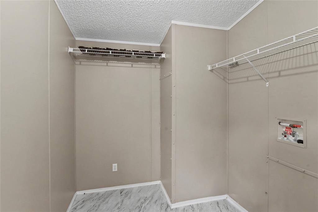 428 Cash Blackmon Road Logansport, LA 71049 - Photo 16 of 40 a view of a room with racks on the wall