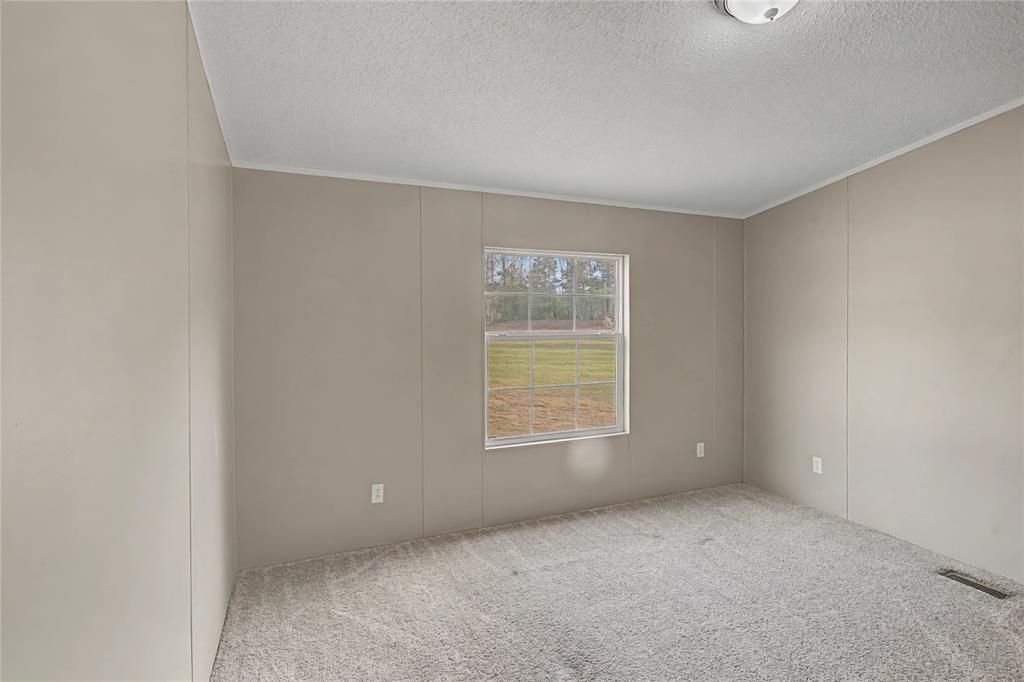 428 Cash Blackmon Road Logansport, LA 71049 - Photo 23 of 40 an empty room with a window