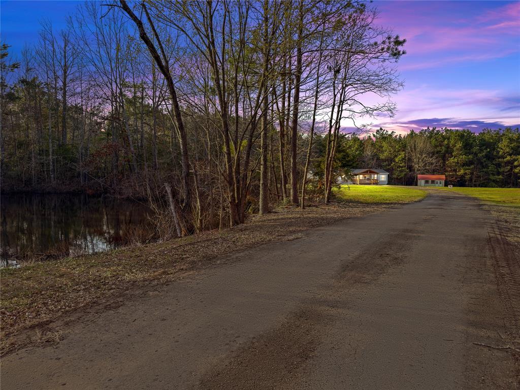 428 Cash Blackmon Road Logansport, LA 71049 - Photo 40 of 40 a view of swimming pool with an outdoor space and seating area