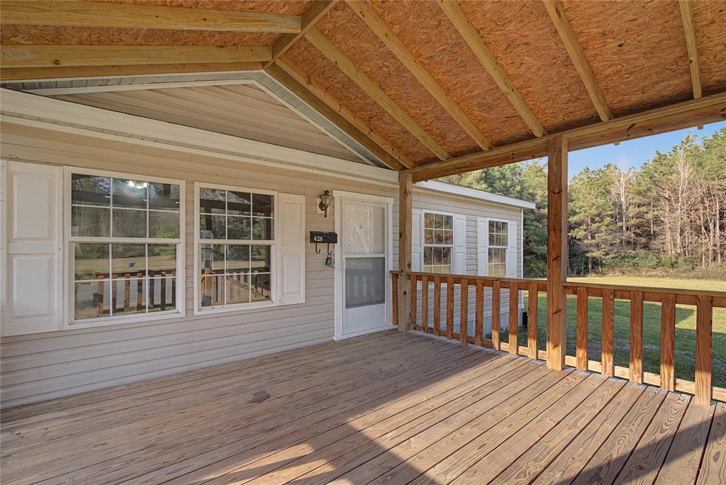 428 Cash Blackmon Road Logansport, LA 71049 - Photo 5 of 40 a view of a house with wooden floor