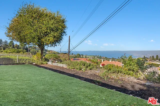 a view of a yard with an outdoor space