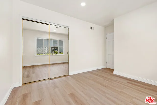 an empty room with mirror