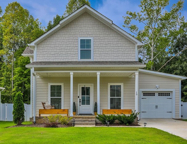 13 Sycamore Ridge West Burns, TN 37029 - Photo 1 of 24 a front view of a house with a yard