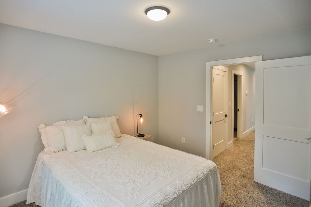 13 Sycamore Ridge West Burns, TN 37029 - Photo 18 of 24 a bedroom with a bed and closet