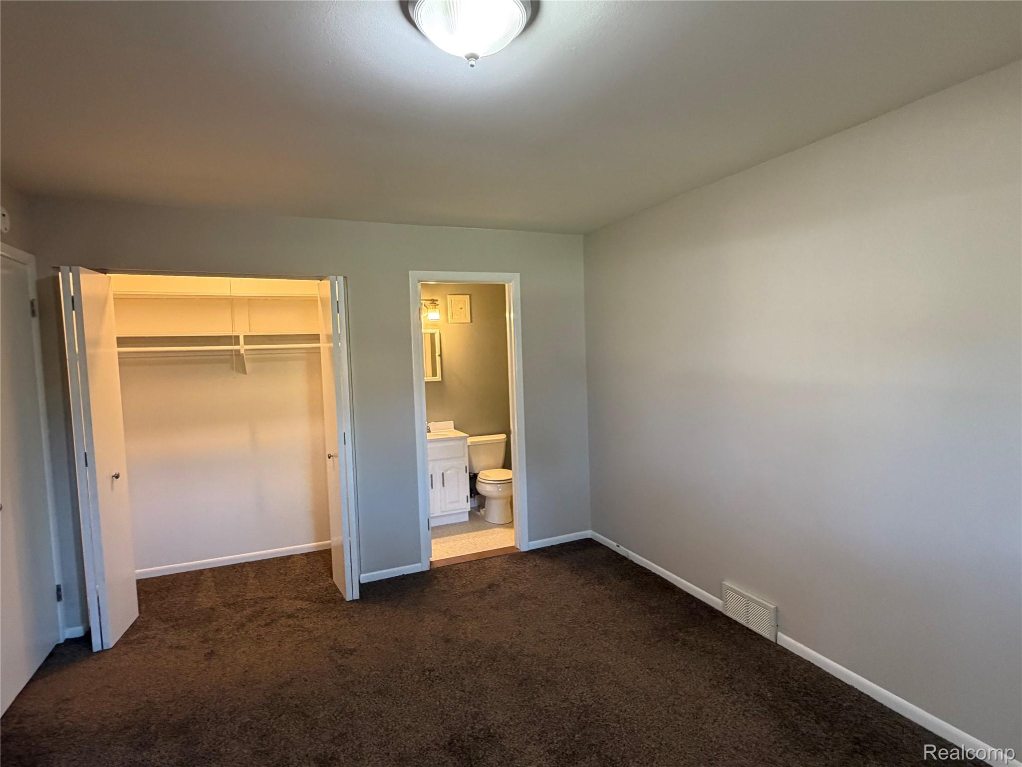 946 North Adams Road, Unit 3 Birmingham, MI 48009 - Photo 12 of 20 Primary Bedroom with Private Powder Bath